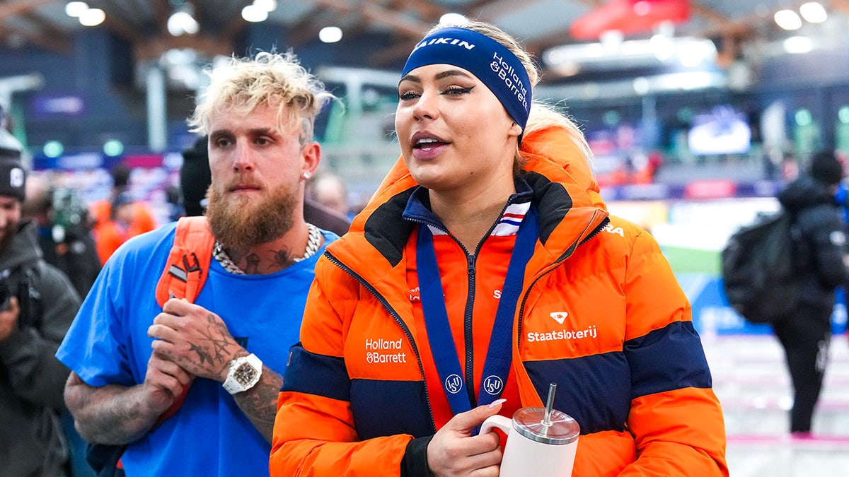 Jutta Leerdam and Jake Paul at a speed skating event