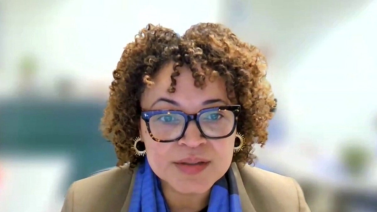 Tikki Brown speaking to the press. 