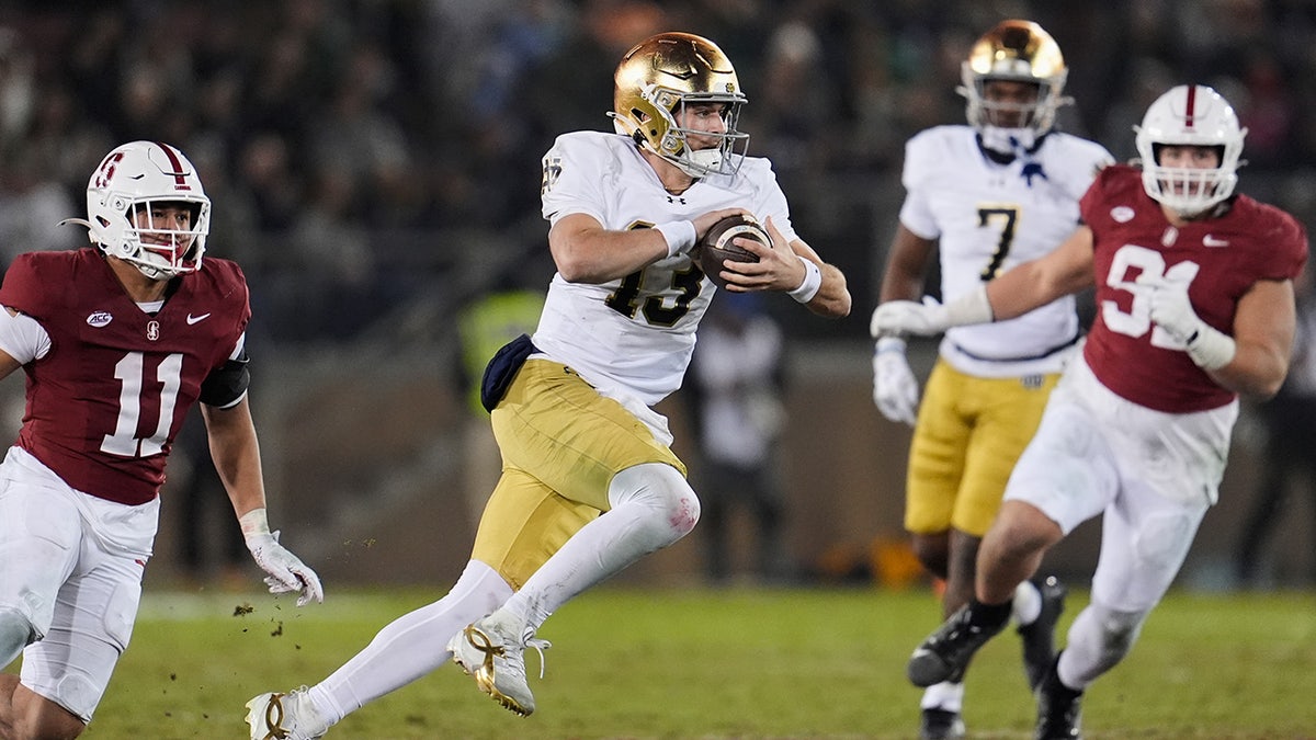 CJ Carr runs with the ball