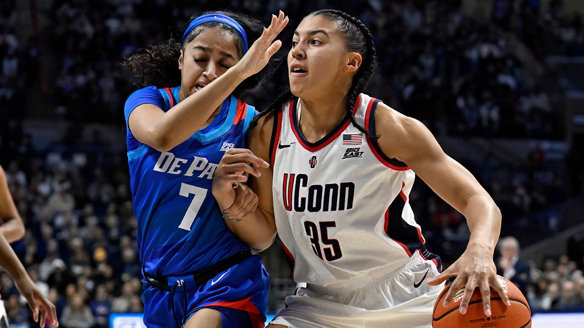 Azzi Fudd drives to the basket