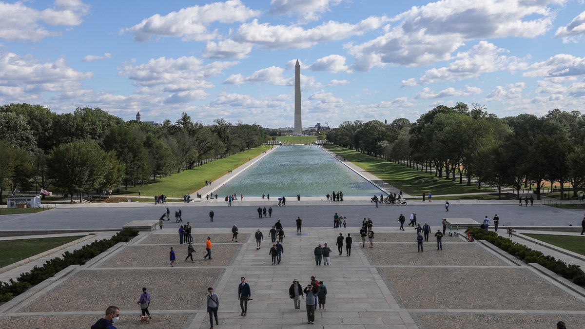 Washington monument is seen in with US Capitol Building in Washington D.C, USA on October 18, 2021.