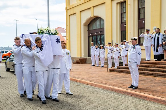 Royal Australian Navy pallbearers carry the coffin before the naval ceremonial funeral service of Rear Admiral (Retd) Rothesay Swan,