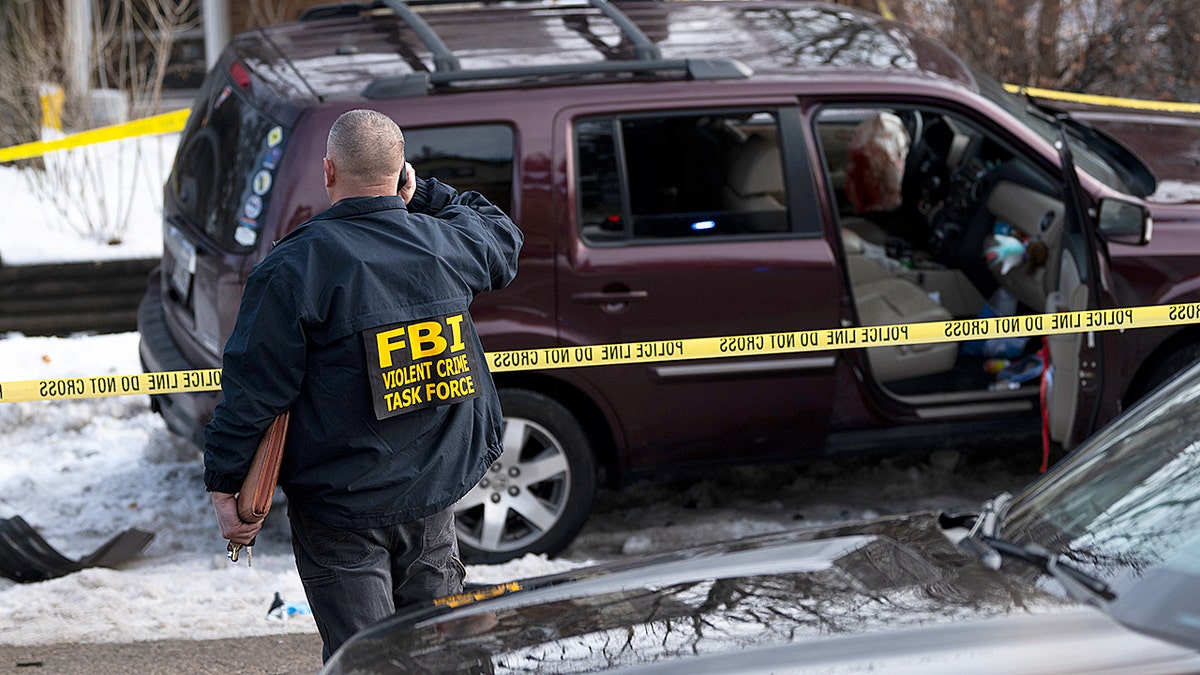 A crashed car at the scene where an ICE agent shot Renee Good.