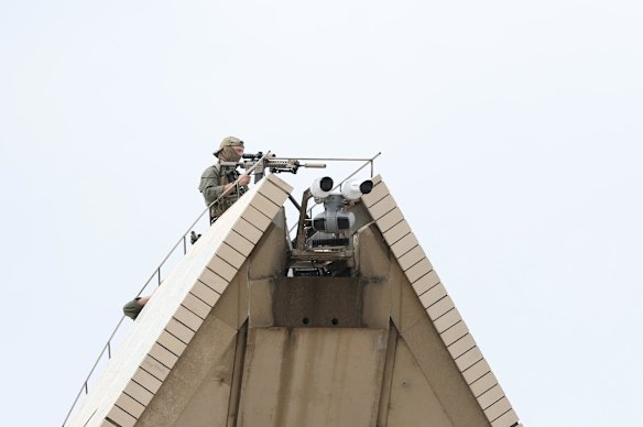 Snipers on top of the Opera House before the memorial service.