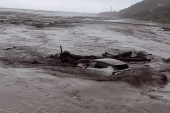 Flooding in Wye River forces a car out to sea on Thursday.