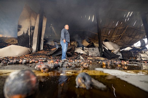 Brian Nunn walks through the remnants of the Harcourt Co-op.