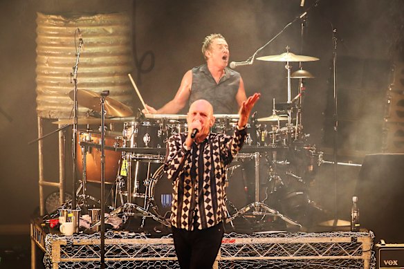 Rob Hirst with Peter Garrett in Midnight Oil.