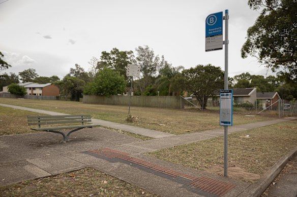 A bus stop in Doonside has only a single seat and no shade.