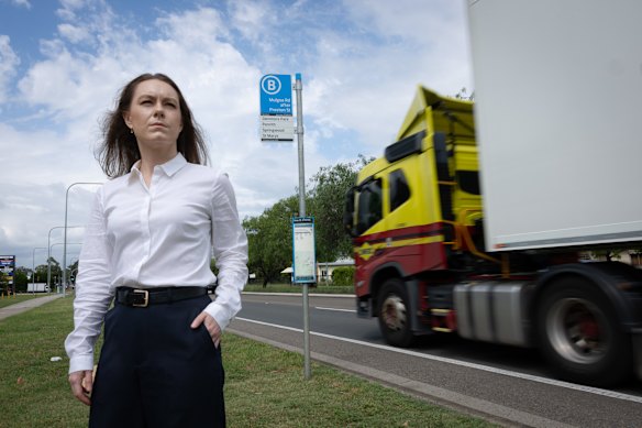 Jacqui Munro stands at a bus stop that has no shade or seating in Penrith, where temperatures often reach up to 40 degrees.