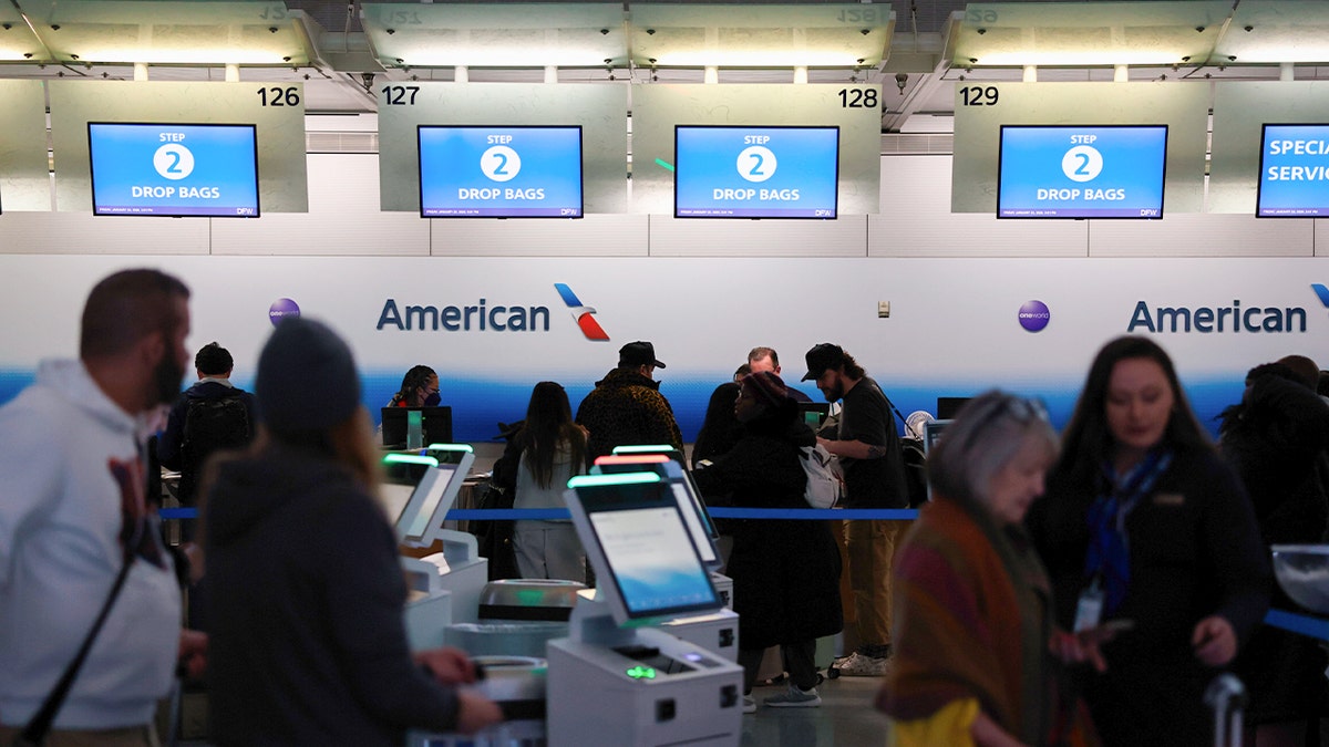 Customers at an American Airlines counter