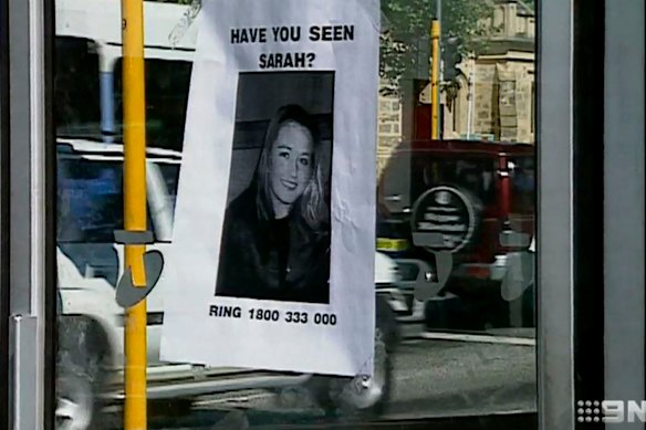 A missing person poster on the public phone booth where Sarah Spiers called for a taxi before she vanished. 