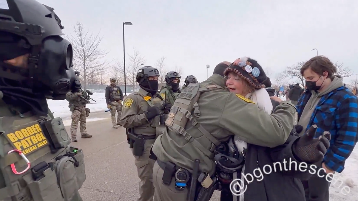 A Border Patrol agent hugged an anti-immigration enforcement protester Thursday in Minnesota.