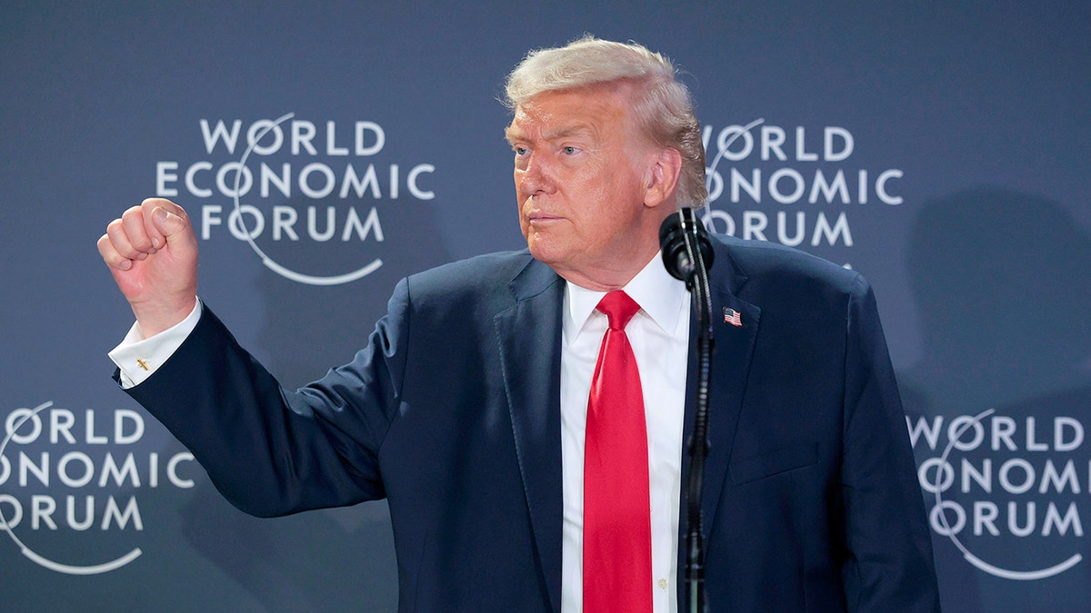 Donald Trump speaking at a podium during a reception in Davos.