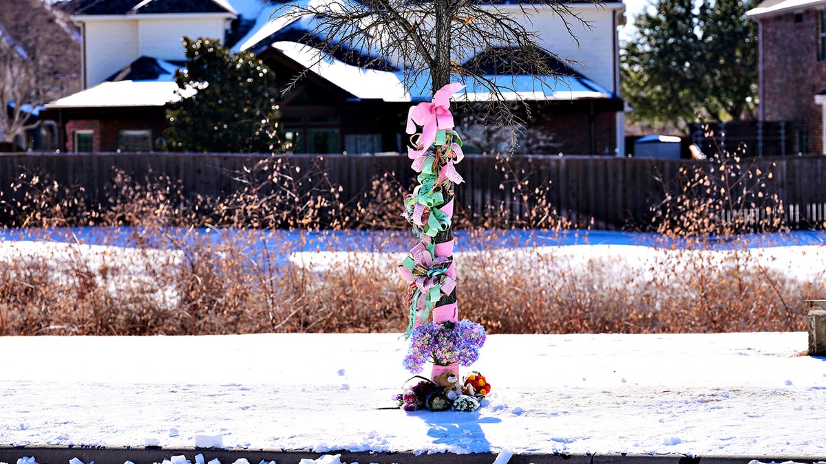 makeshift memorial around tree
