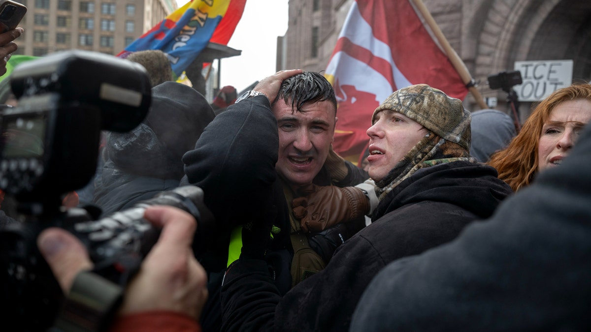 Jake Lang tries to escape angry mob