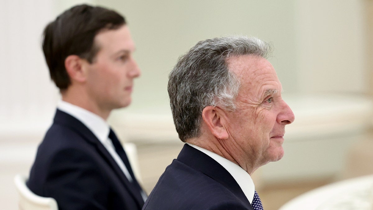 U.S. officials sitting at table