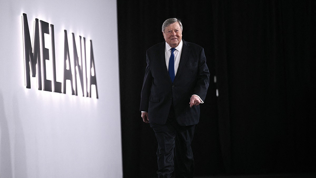 Viktor Knavs walking down red carpet at the premiere of "Melania" movie.