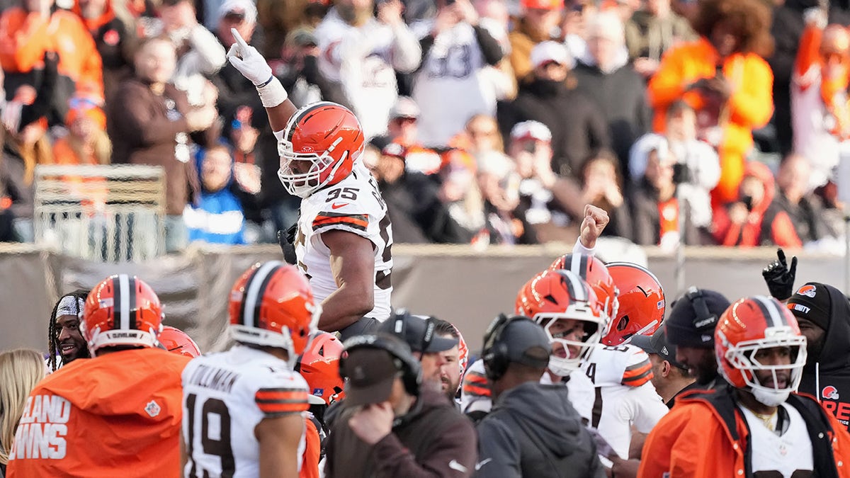 Myles Garrett hoisted by teammates