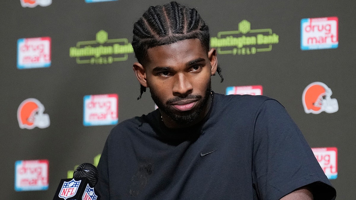 Shedeur Sanders looks on