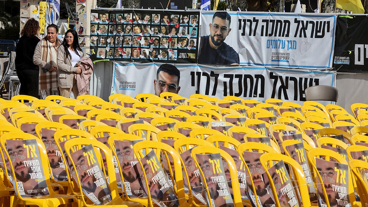Chairs and banners with images of Ran Gvili in Hostage Square
