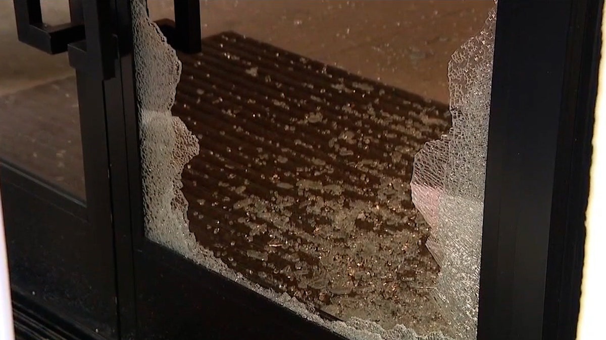 Shattered glass at Lululemon storefront entrance