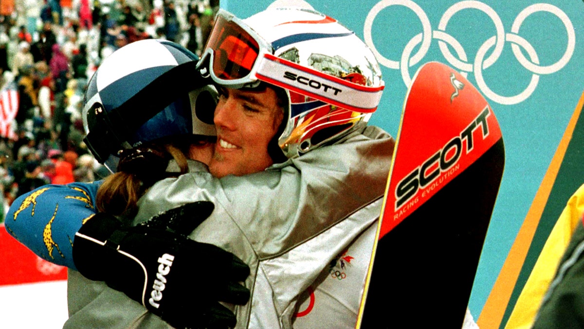 Ueli Kestenholz hugging teammate after bronze medal win