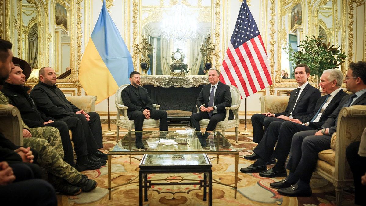 The Ukrainian leader sits with American diplomatic representatives during a formal meeting in Paris.