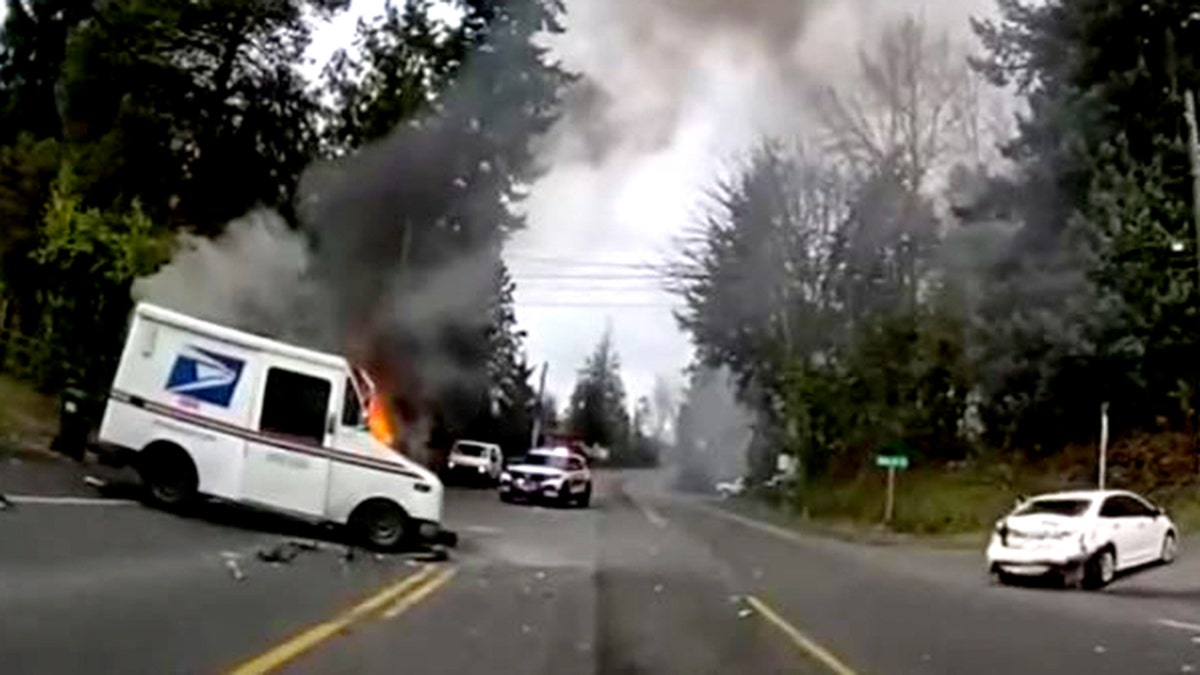 mail truck on fire and damaged sedan