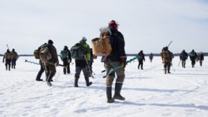 When the fish stop biting, ice fishers follow the crowd