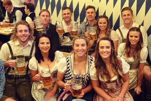 Joel Selwood and Mitch Duncan (rear centre) with their wives Demi and Britt (right) on the German trip, which was also attended by other Geelong players not linked to Nguyen.