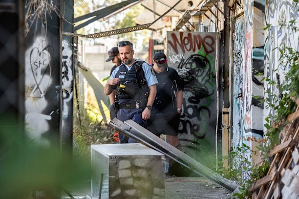 Police at the scene after a fire at the Homebush Theatre overnight.