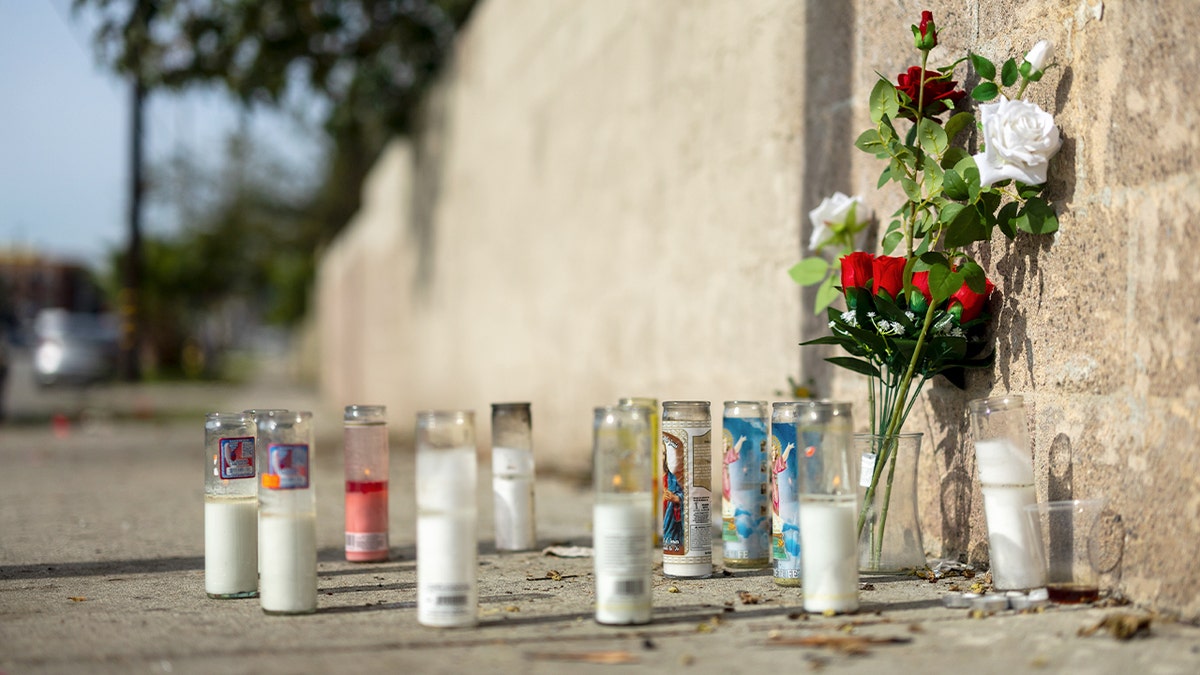 A memorial for former NFL and Westchester High lineman Kevin Johnson sit near a homeless encampment in Willowbrook on Sunday, Jan. 25, 2026 in Los Angeles, Calif. 