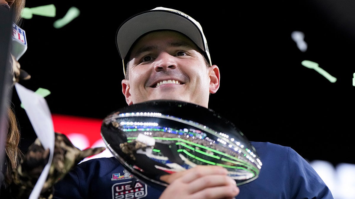 Mike Macdonald the with Super Bowl trophy