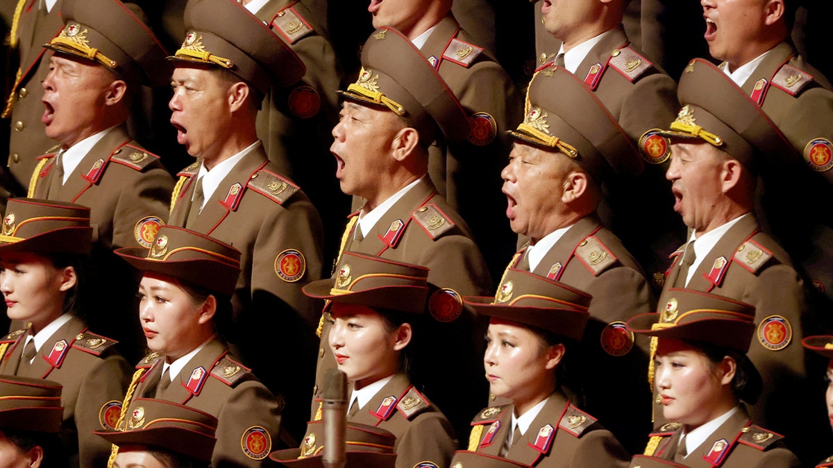 Uniformed singers perform onstage during a diplomatic concert in Pyongyang.