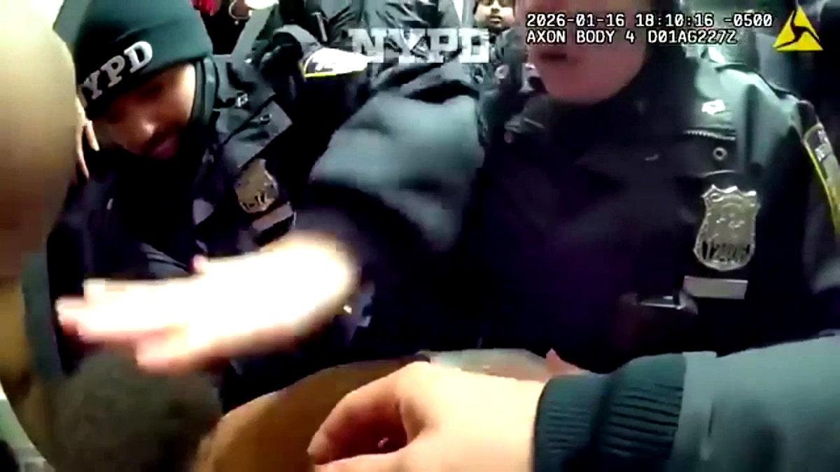 Officers administering back blows on the choking child.
