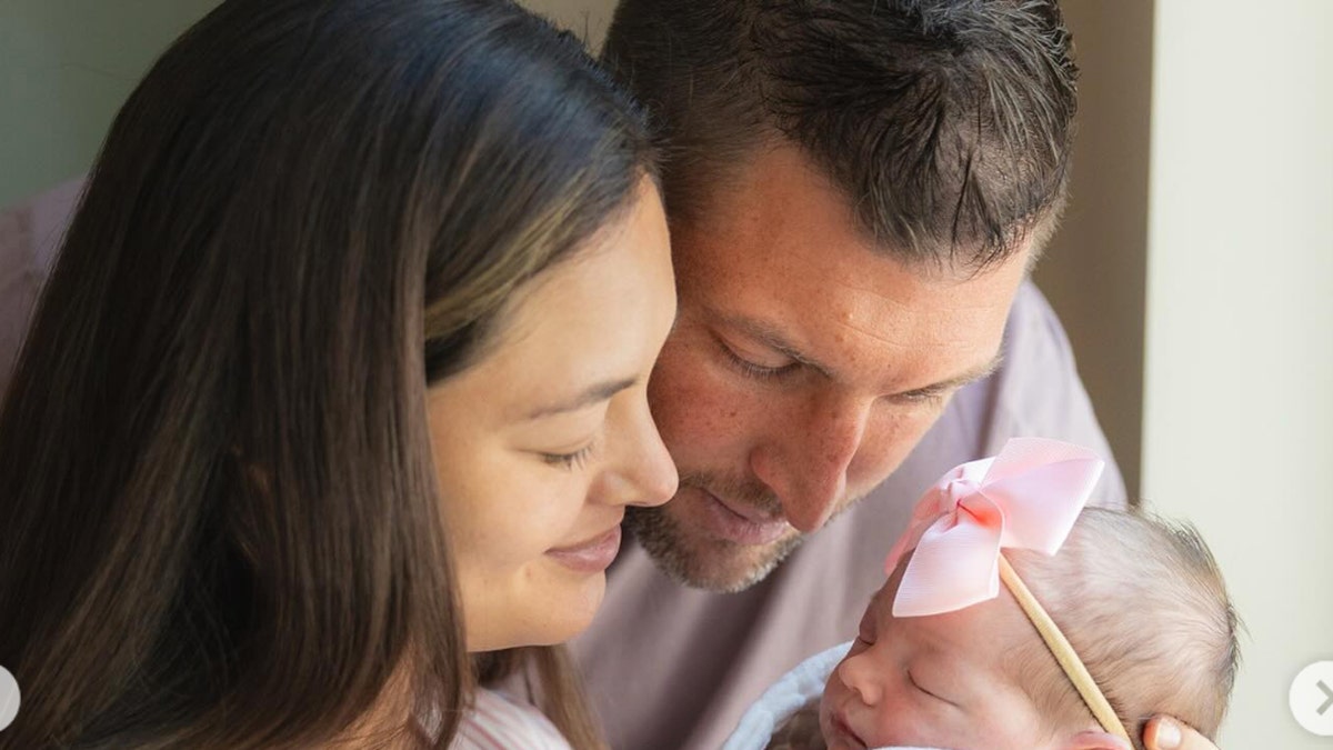Tebow family in a closeup picture, with newborn daughter