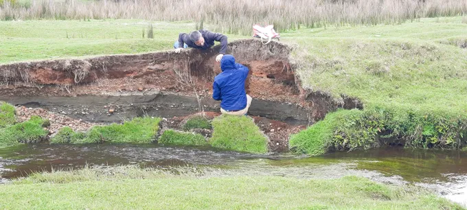 Researchers work at a creekbed nearr Monte Verde