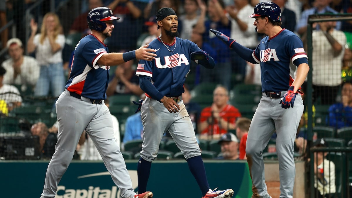 Cal Raleigh #29, Byron Buxton #25, and Roman Anthony #3 of the United States celebrate after scoring from an RBI double hit by Brice Turang #13 of the United States in the fifth inning against Brazil during the 2026 World Baseball Classic Pool B game between the United States and Brazil at Daikin Park on March 6, 2026 in Houston, Texas. 