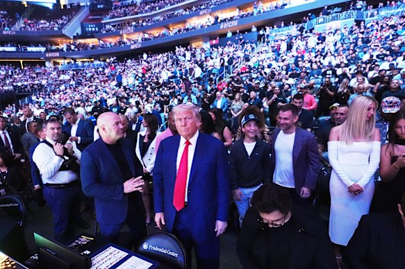 Donald Trump attends a mixed martial arts event in New Jersey in June 2025 as UFC head Dana White looks on.