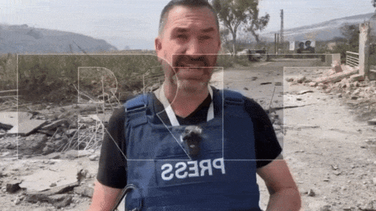 The moment Russia Today correspondent Steve Sweeney was wounded in an Israeli strike.