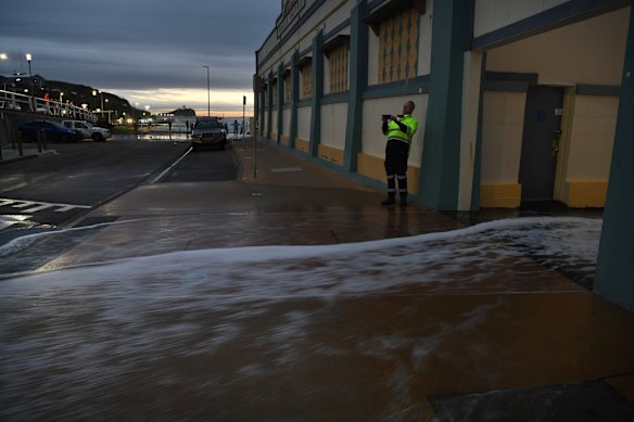 The waves were up and onto the road at Newcastle at sunrise this morning. 