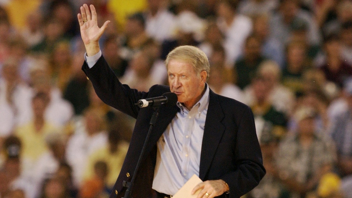 Bob Harlan waves to fans