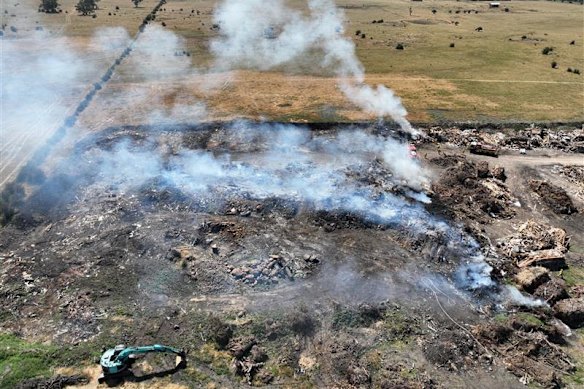 Waste material smoulders at the alleged unlawful burn-off site in Wollert.
