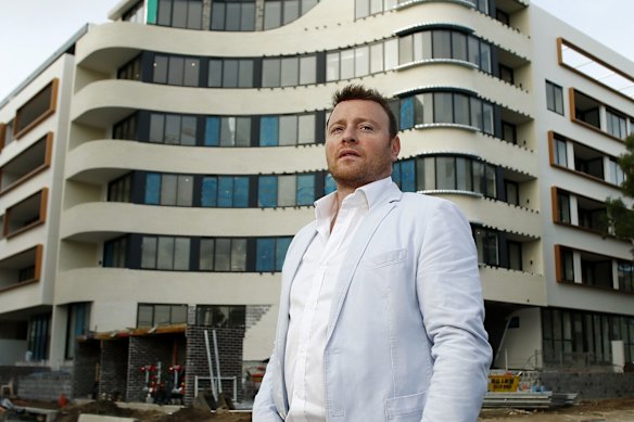Fridman poses out the front of an apartment development in the Sydney suburb of Erskineville.
