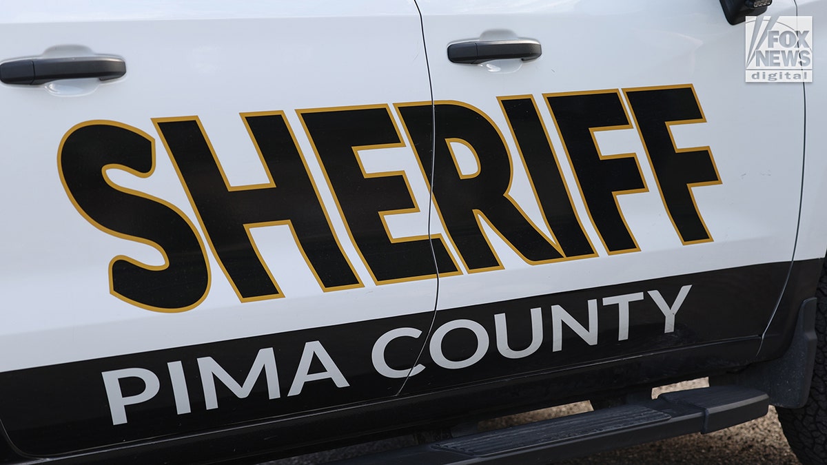 Pima County Sheriff's deputies assembling in front of Nancy Guthrie's home