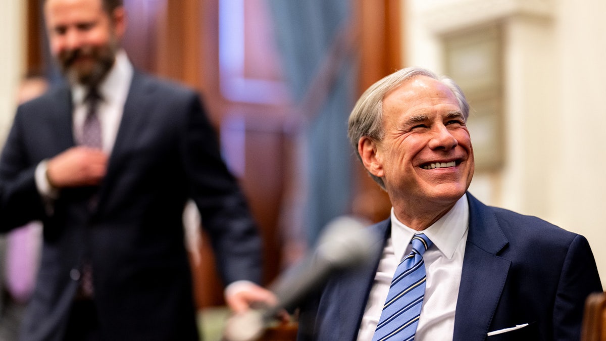 Texas Gov. Greg Abbott smiles during a bill signing in Austin
