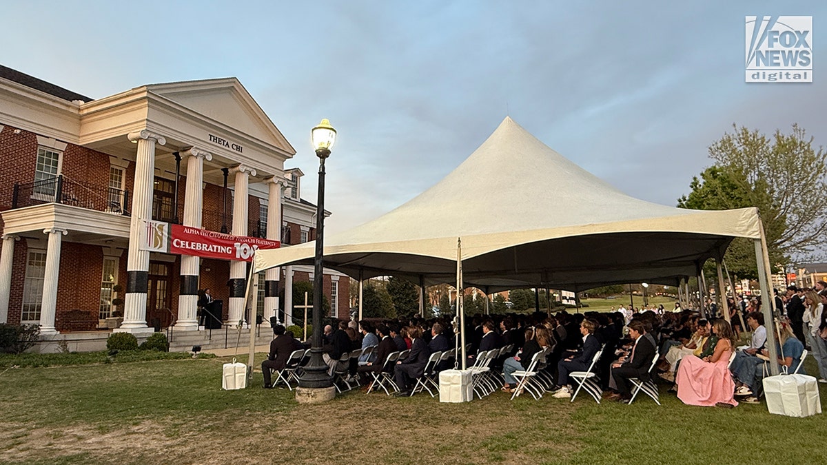 Mourners at a memorial vigil for Jimmy Gracey standing together