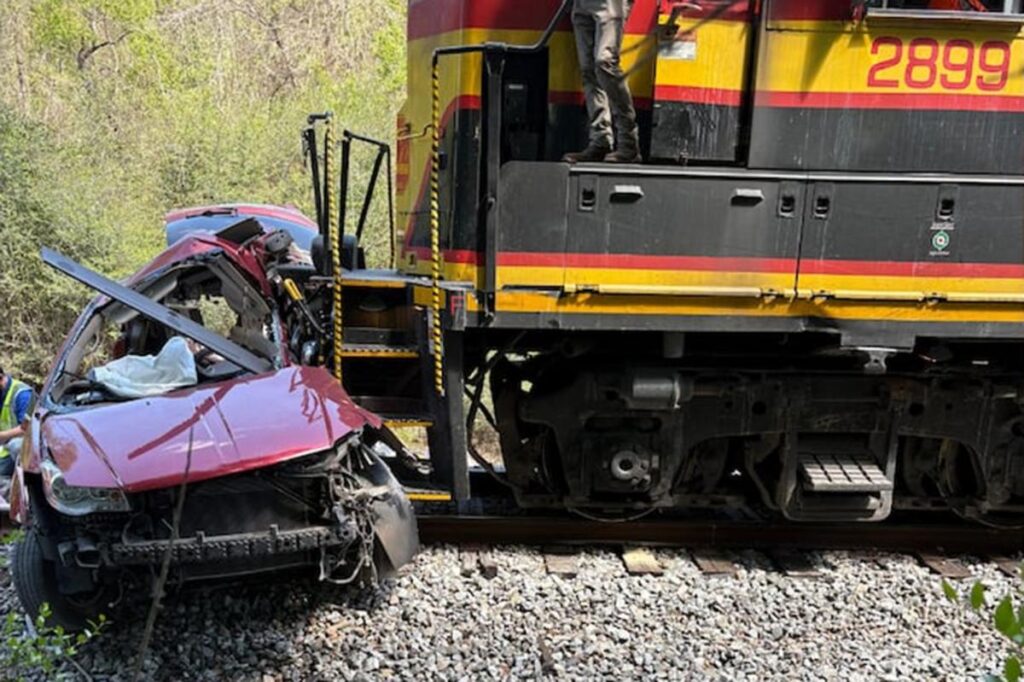 5 killed after freight train hits van at railroad crossing in rural Mississippi