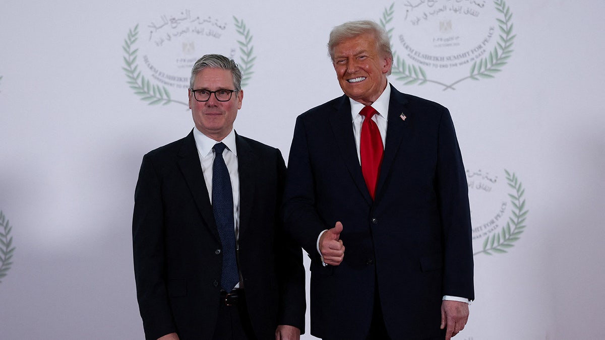 U.S. President Donald Trump and British Prime Minister Keir Starmer pose for a photo, at a world leaders' summit on ending the Gaza war.