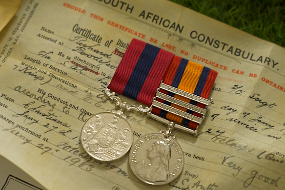 Richard Walsh’s medals side by side with the paperwork underneath. The one on the left is the DCM - it’s only a replica because the original is missing.